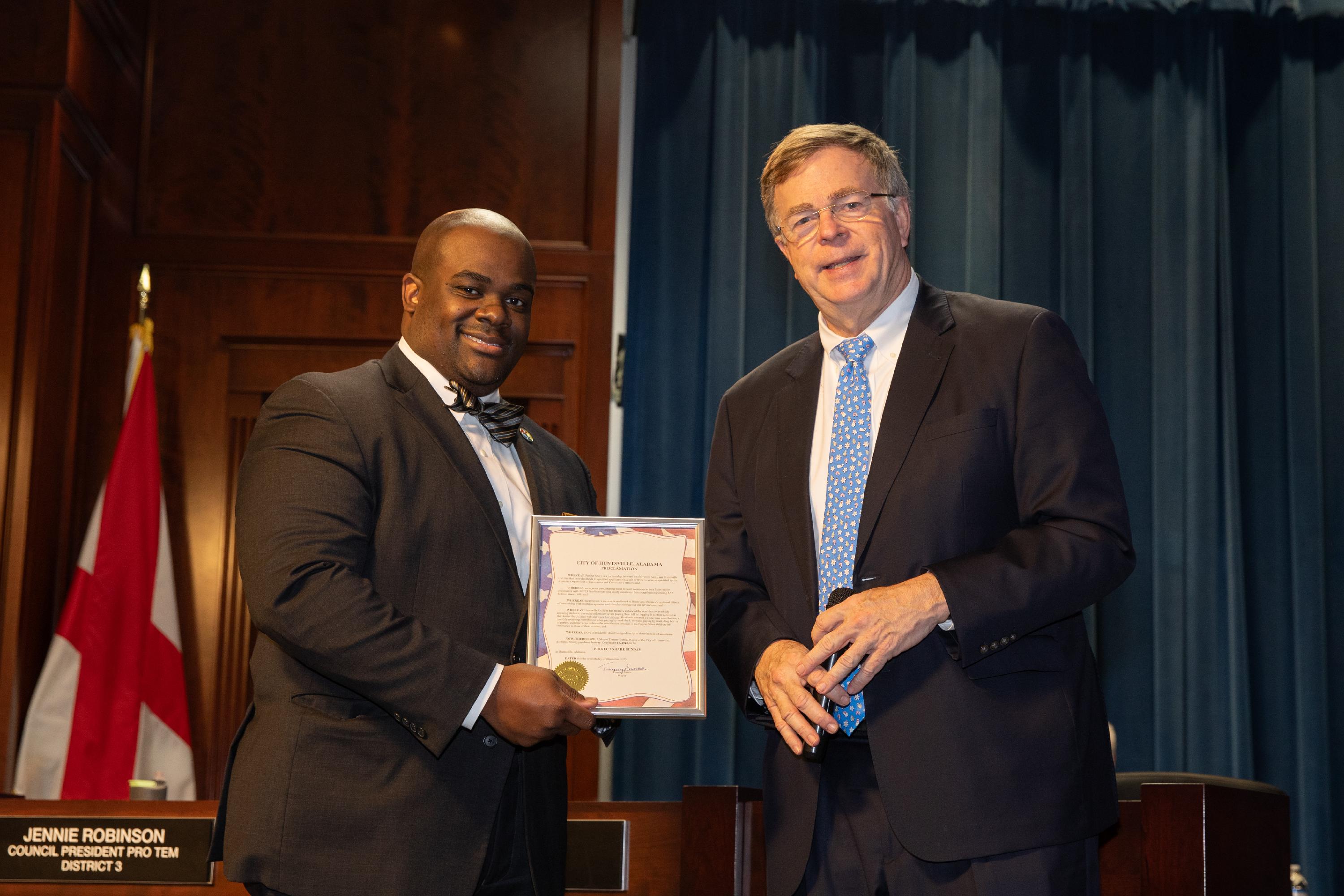 Gary Whitley of Huntsville Utilities accepting the proclamation from Mayor Tommy Battle.