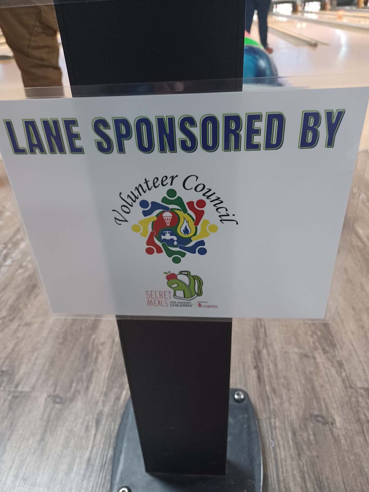 Sign that reads "Lane Sponsored by Huntsville Utilities Volunteer Council."