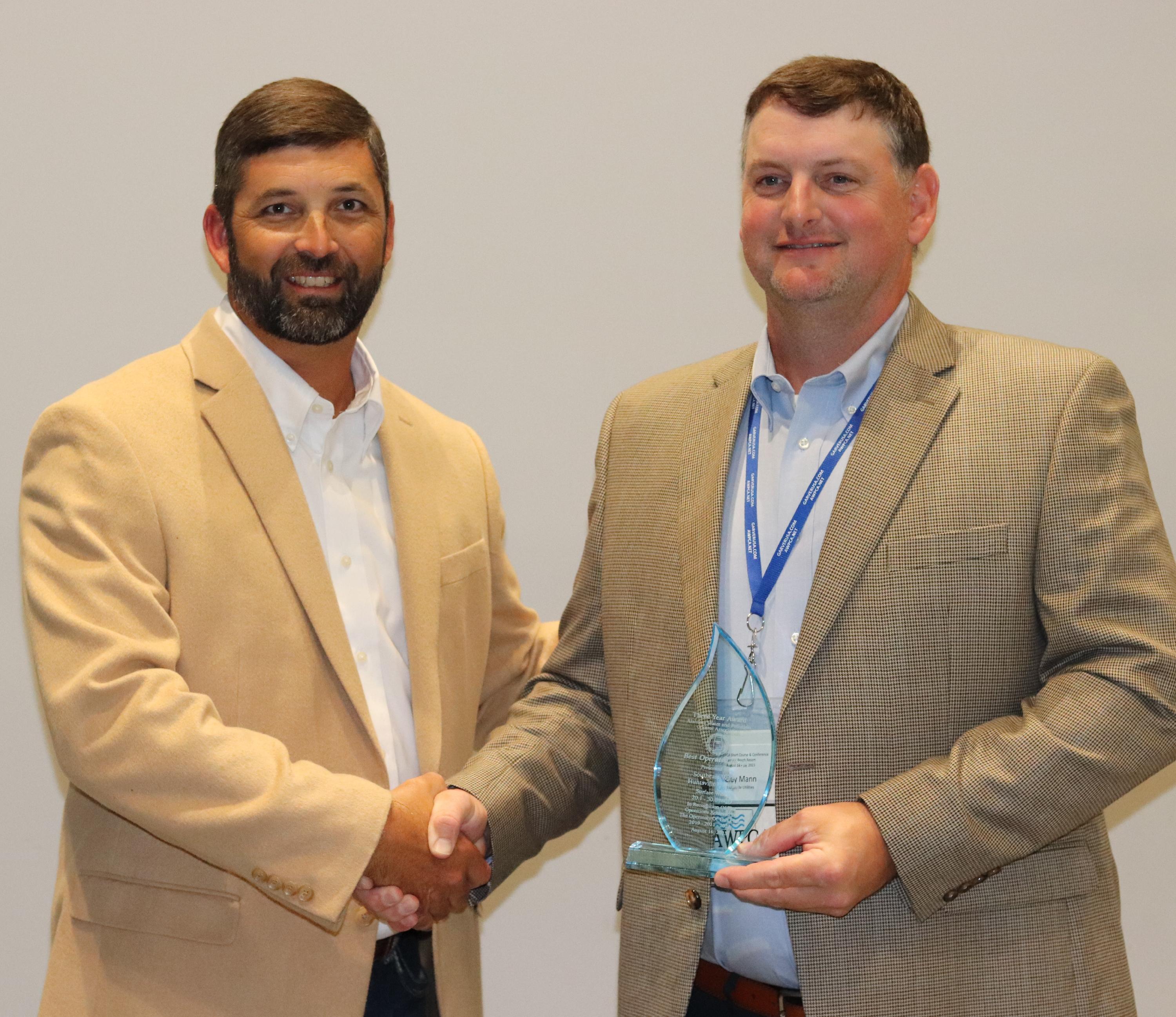 Clay Mann of Huntsville Utilities accepting the 3-year award for Best Operated Plant (20.1-30 MGD)